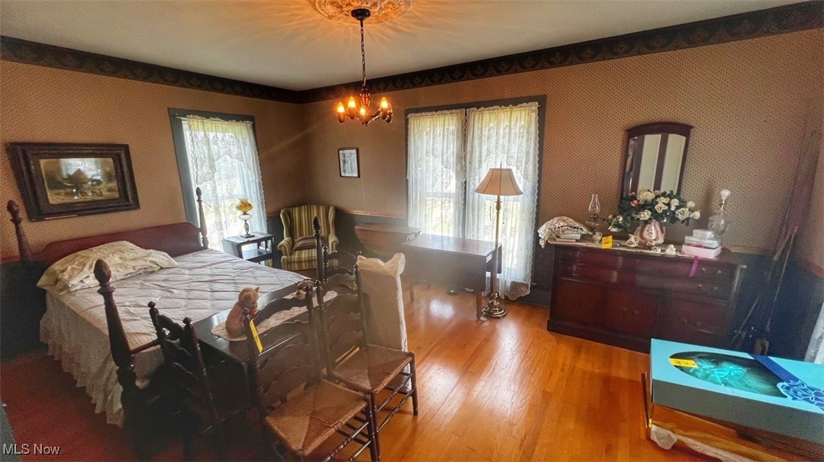 3956 Tallmadge Road Rootstown, OH 44272 - Photo 18 of 26 Bedroom with light hardwood / wood-style floors and a chandelier