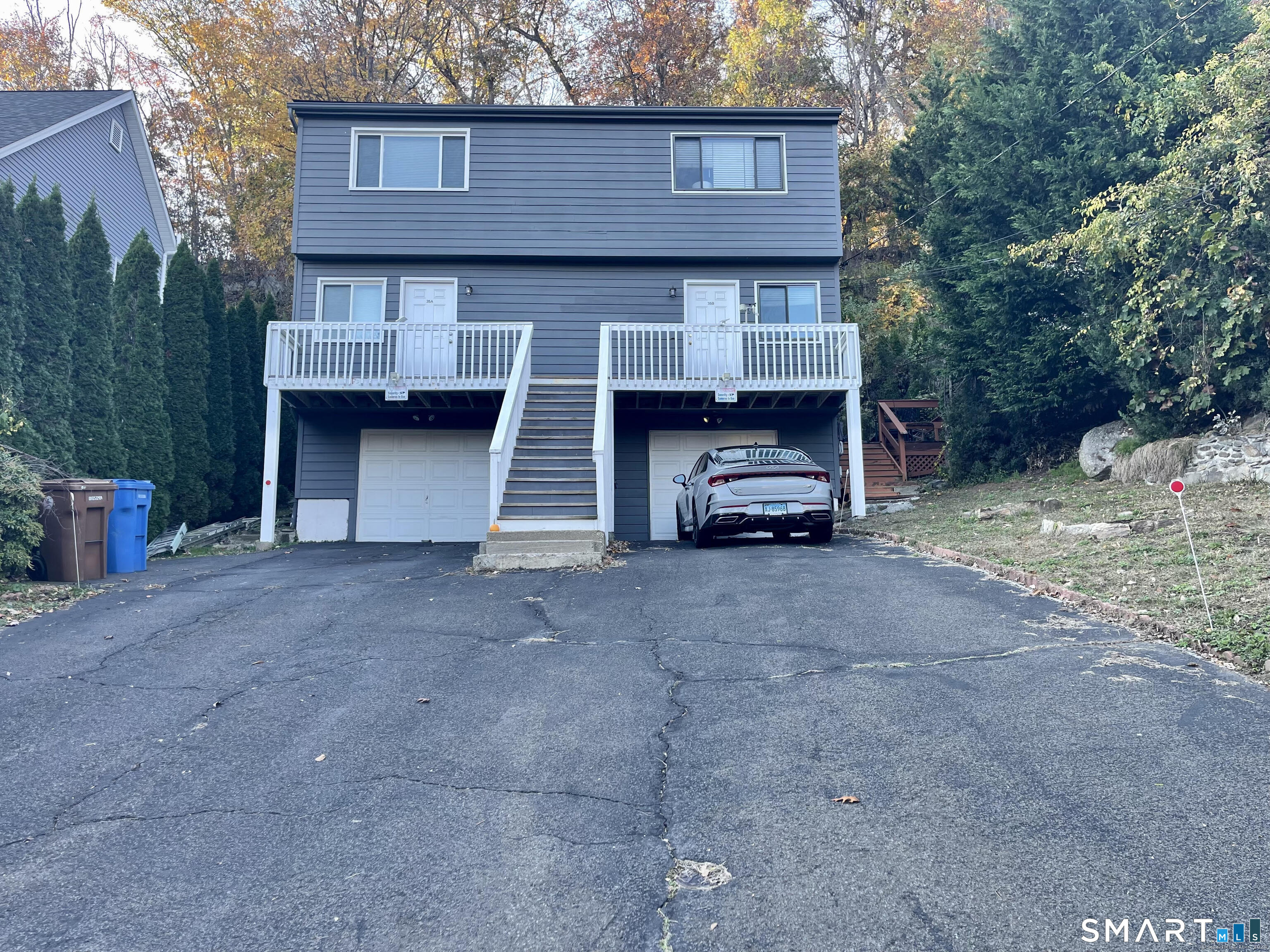 35 Ojibwa Road, Unit A Shelton, CT 06484 - Photo 1 of 8 a car parked in front of a house