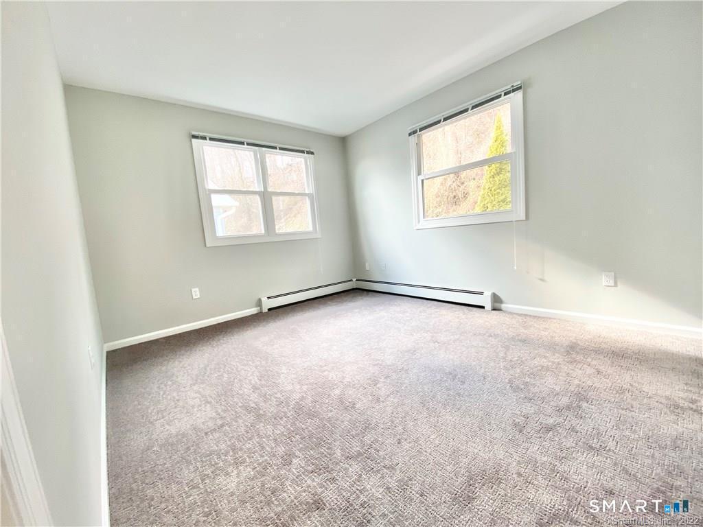 35 Ojibwa Road, Unit A Shelton, CT 06484 - Photo 6 of 8 an empty room with windows