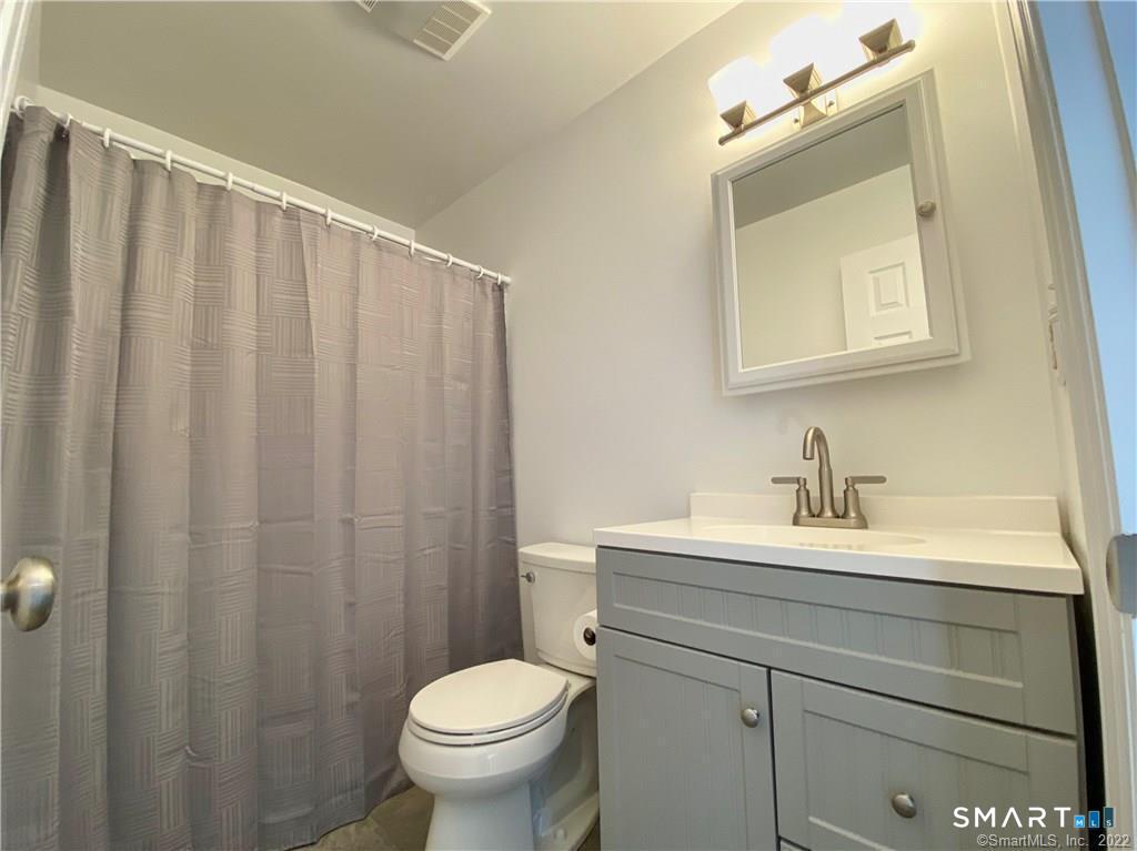 35 Ojibwa Road, Unit A Shelton, CT 06484 - Photo 8 of 8 a bathroom with a sink a toilet and mirror