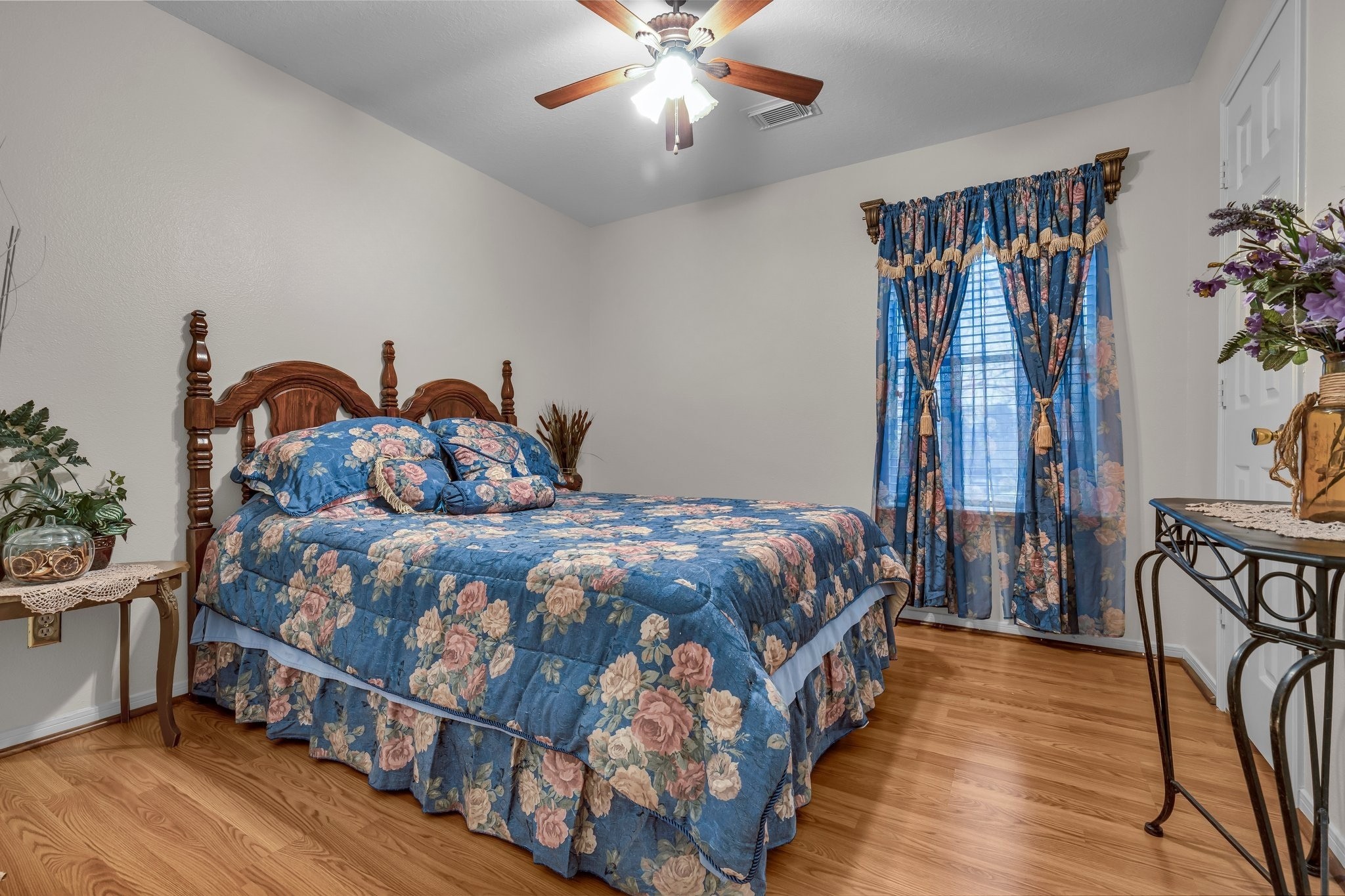 1130 Fairlane Square Channelview, TX 77530 - Photo 12 of 22 a bedroom with a large bed and a chandelier