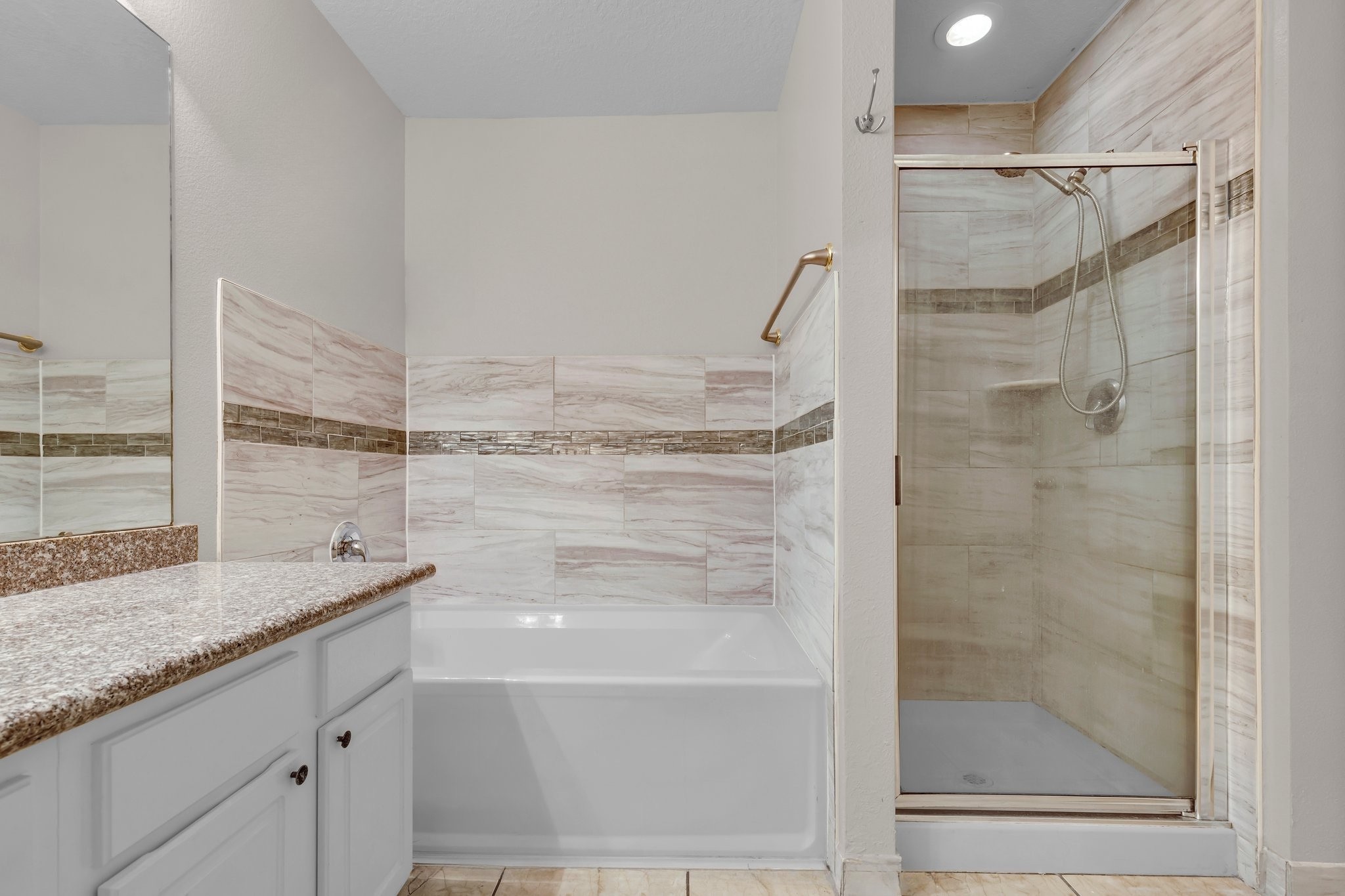 1130 Fairlane Square Channelview, TX 77530 - Photo 18 of 22 a bathroom with a granite countertop bathtub shower sink and mirror