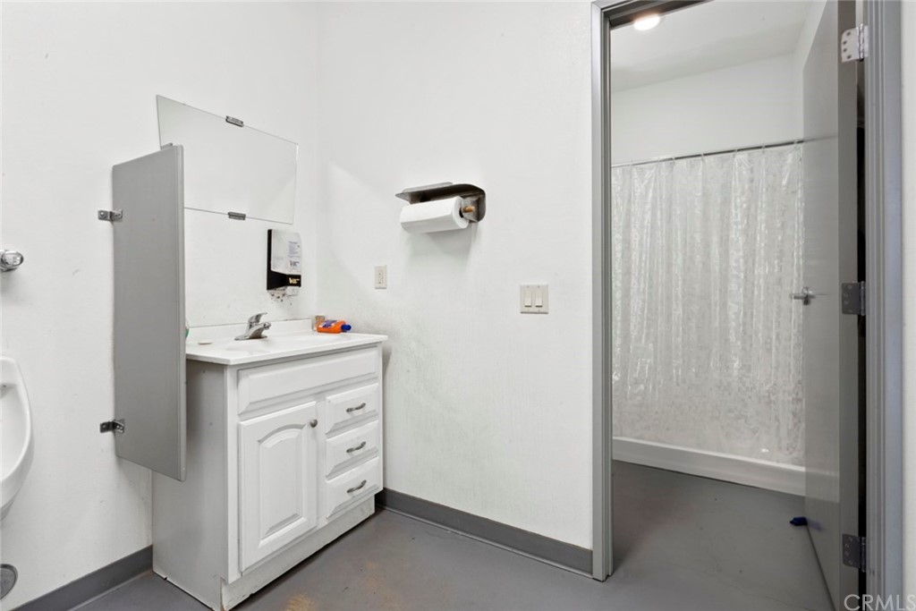 17850 Vista Del Lago Drive Riverside, CA 92503 - Photo 13 of 43 a bathroom with a sink vanity and a mirror