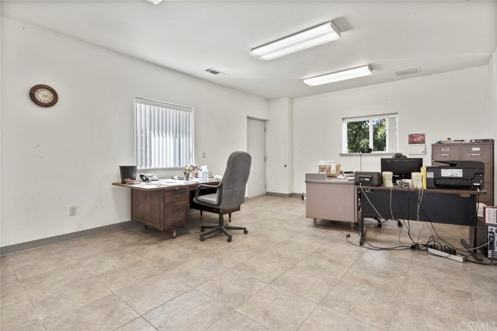 17850 Vista Del Lago Drive Riverside, CA 92503 - Photo 16 of 43 a view of a workspace with furniture and a window