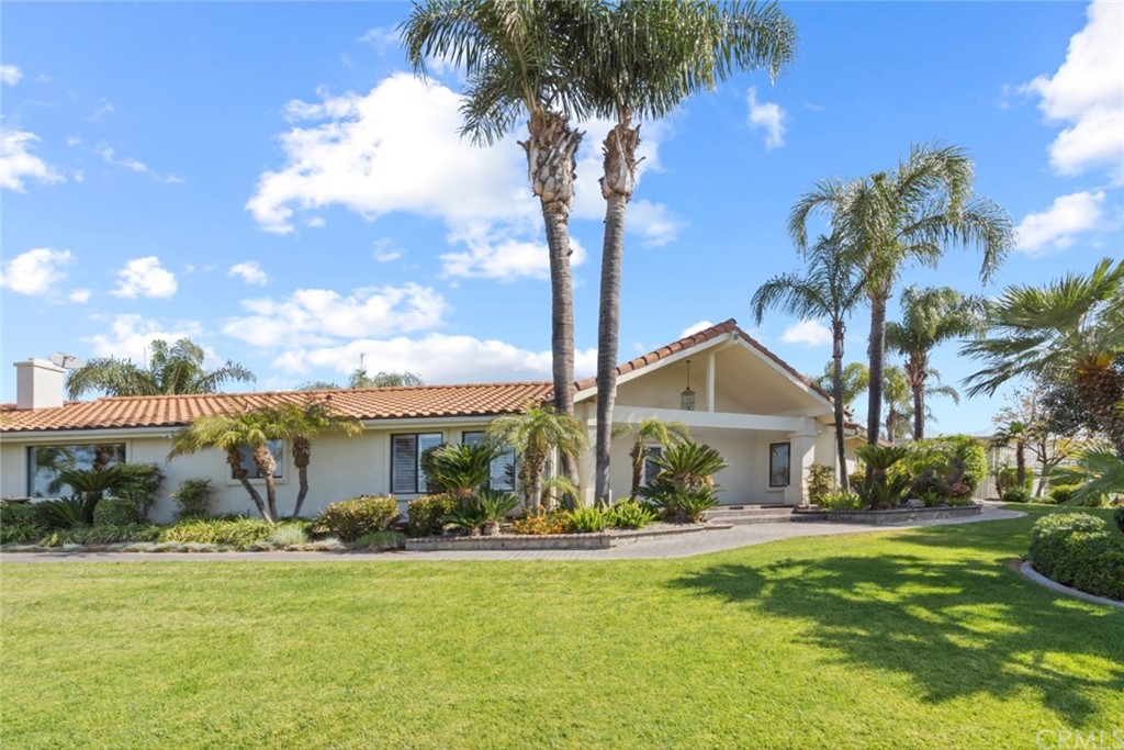 17850 Vista Del Lago Drive Riverside, CA 92503 - Photo 19 of 43 a front view of a house with garden