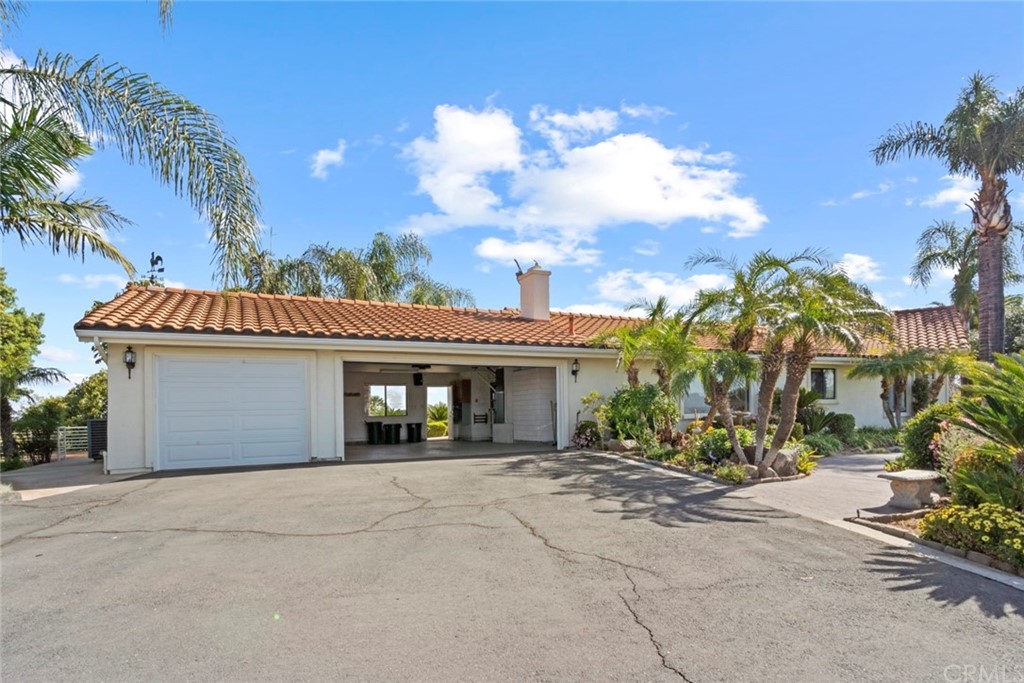 17850 Vista Del Lago Drive Riverside, CA 92503 - Photo 20 of 43 a front view of a house with garden