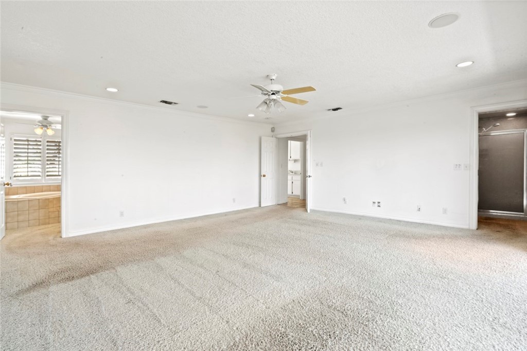 17850 Vista Del Lago Drive Riverside, CA 92503 - Photo 23 of 43 an empty room with a ceiling fan and a window