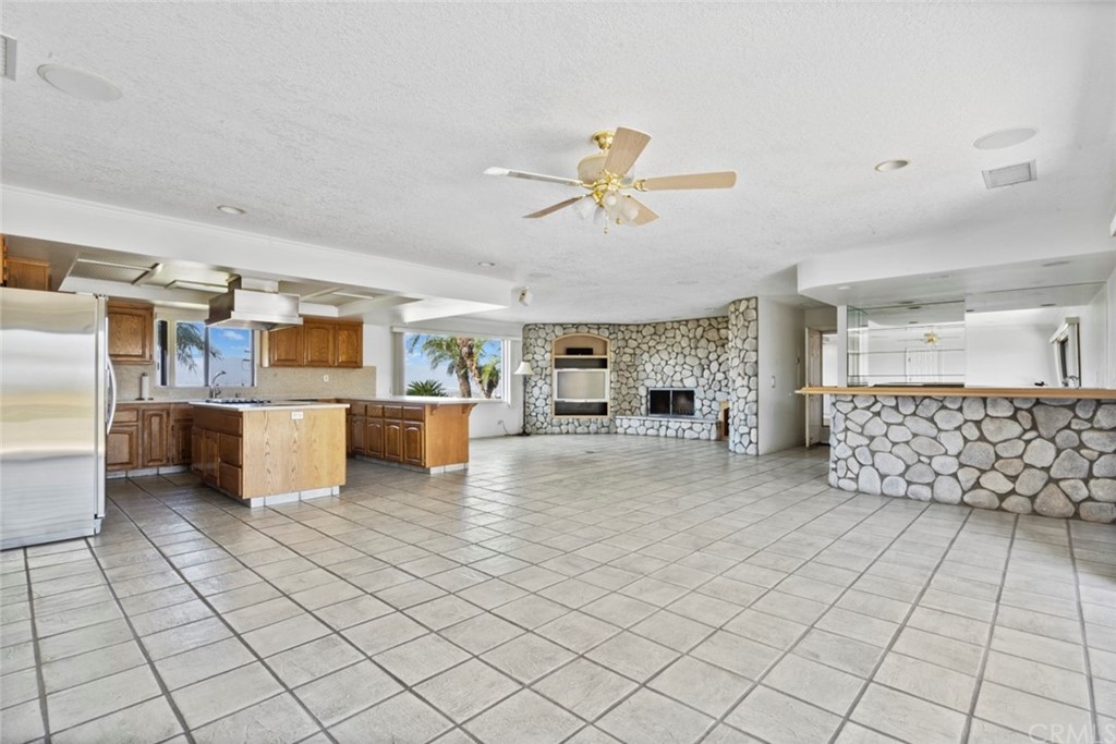 17850 Vista Del Lago Drive Riverside, CA 92503 - Photo 26 of 43 a living room with a couch and a chandelier