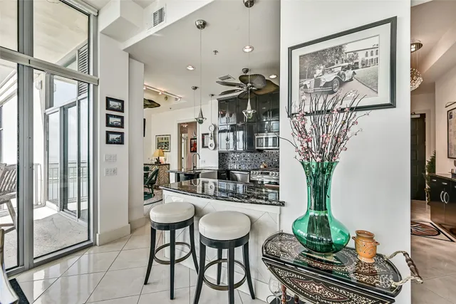 a room with furniture and a potted plant