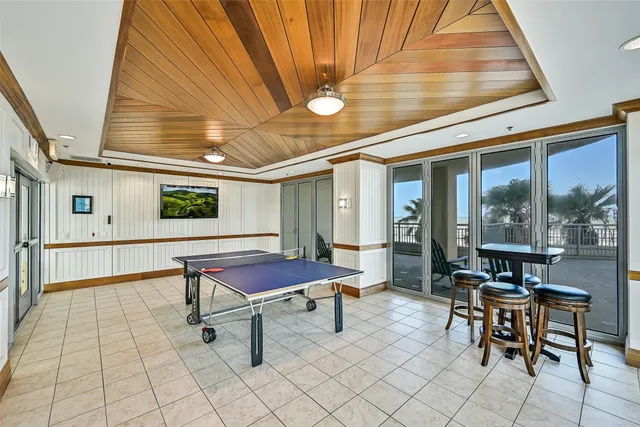 a reading room with furniture and window
