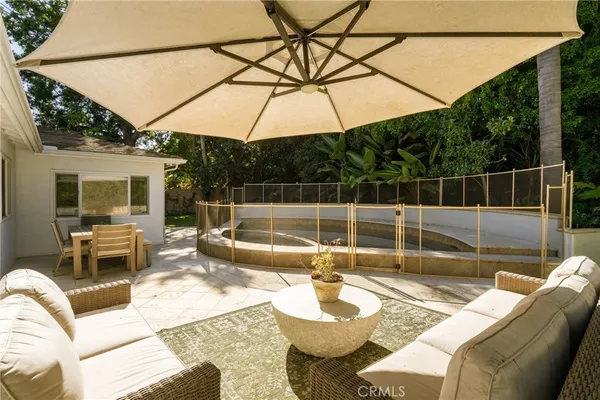 swimming pool view with a seating space