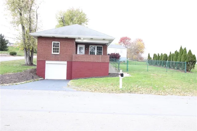 a backyard of a house with a garden and entertaining space