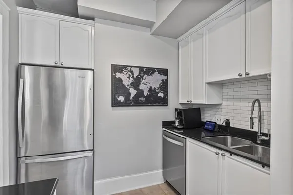 a view of a hallway with washer and dryer