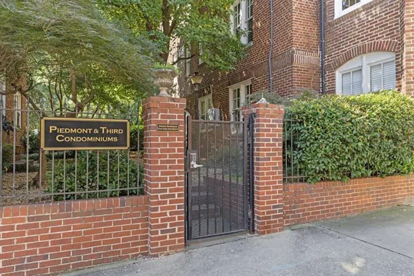 a view of a chairs and table in backyard of the house