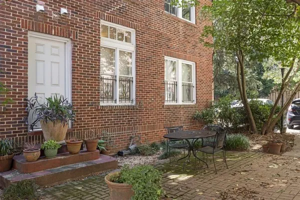 a backyard of a house with outdoor seating