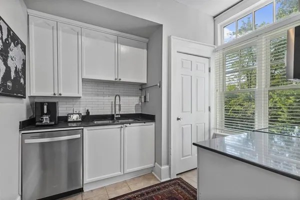 a kitchen with a sink and a window