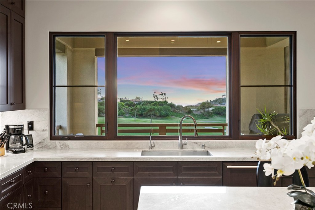 6 Monarch Beach Resort North Dana Point, CA 92629 - Photo 14 of 47 a kitchen with a sink and a large window