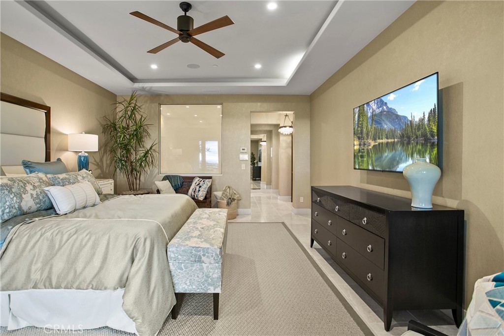 6 Monarch Beach Resort North Dana Point, CA 92629 - Photo 21 of 47 a bedroom with a large bed and a flat tv screen on dresser