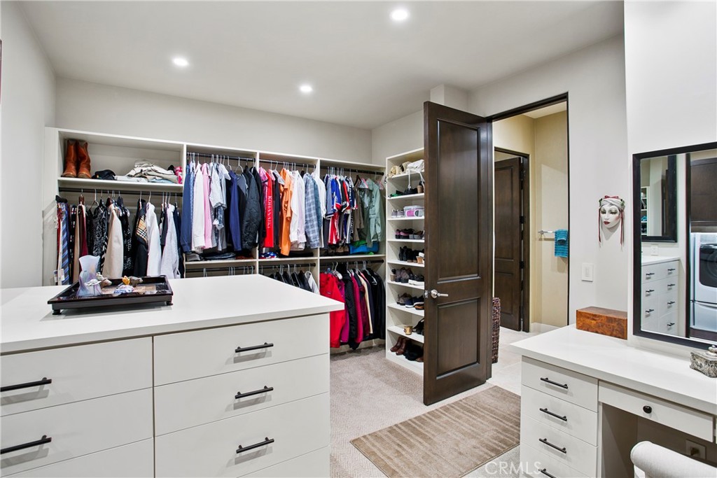 6 Monarch Beach Resort North Dana Point, CA 92629 - Photo 25 of 47 a view of walk in closet with clothes