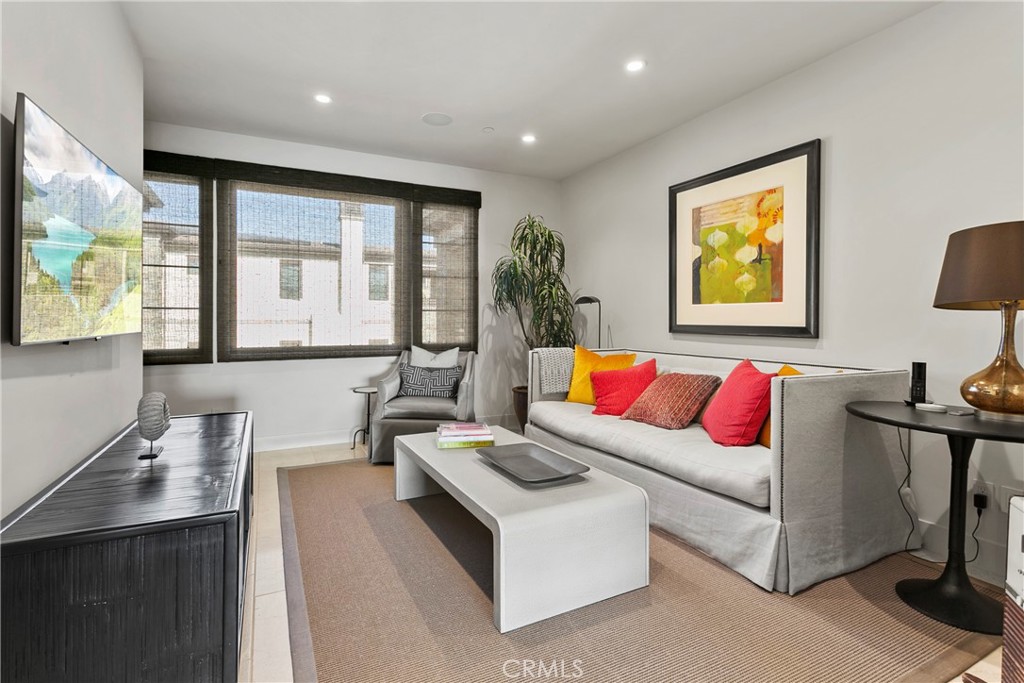 6 Monarch Beach Resort North Dana Point, CA 92629 - Photo 27 of 47 a living room with furniture and a flat screen tv