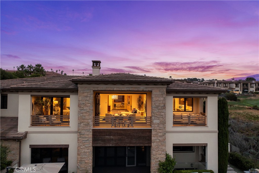 6 Monarch Beach Resort North Dana Point, CA 92629 - Photo 41 of 47 a front view of a house with a yard and mountain view