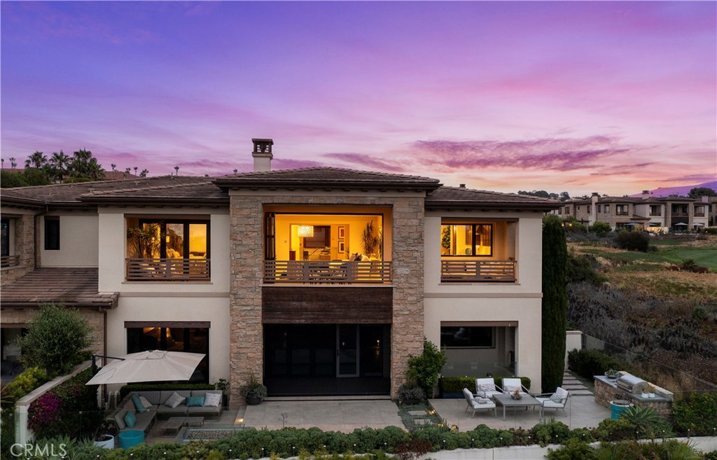 6 Monarch Beach Resort North Dana Point, CA 92629 - Photo 42 of 47 a front view of a house with a yard
