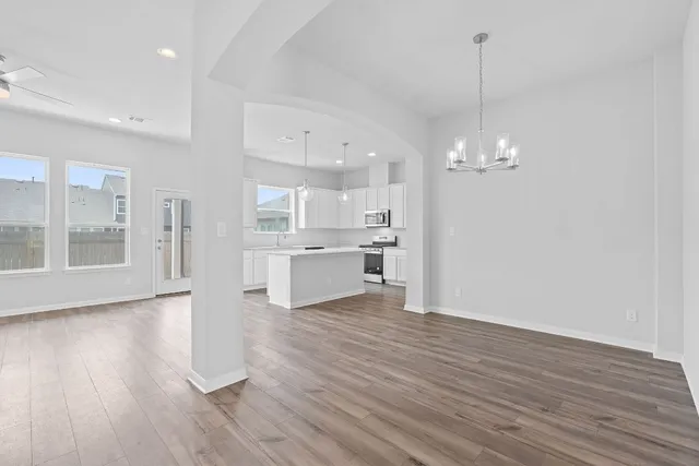 a view of kitchen with wooden floor and window