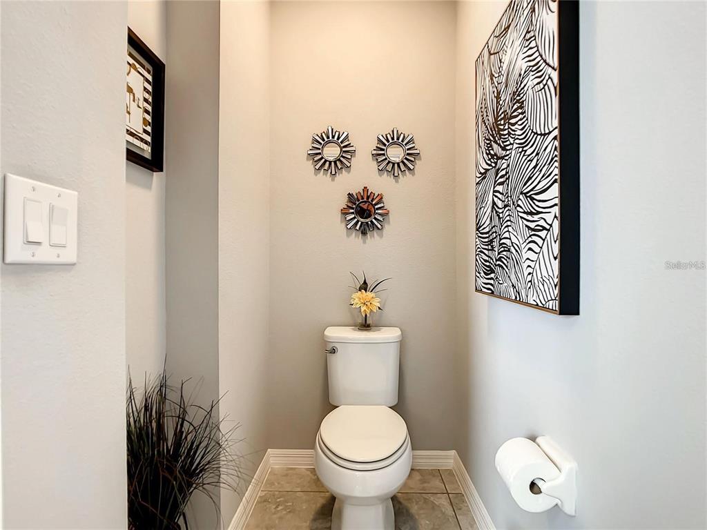1300 Cavender Creek Road Minneola, FL 34715 - Photo 17 of 28 a bathroom with a toilet and a sink