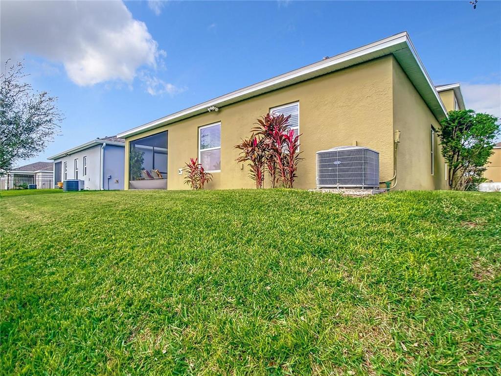 1300 Cavender Creek Road Minneola, FL 34715 - Photo 20 of 28 a front view of house with yard and trees in the background