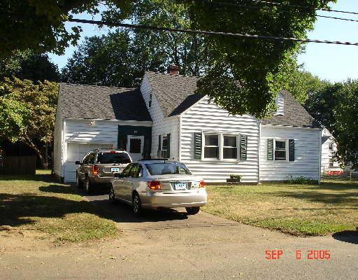 a car parked in front of a house