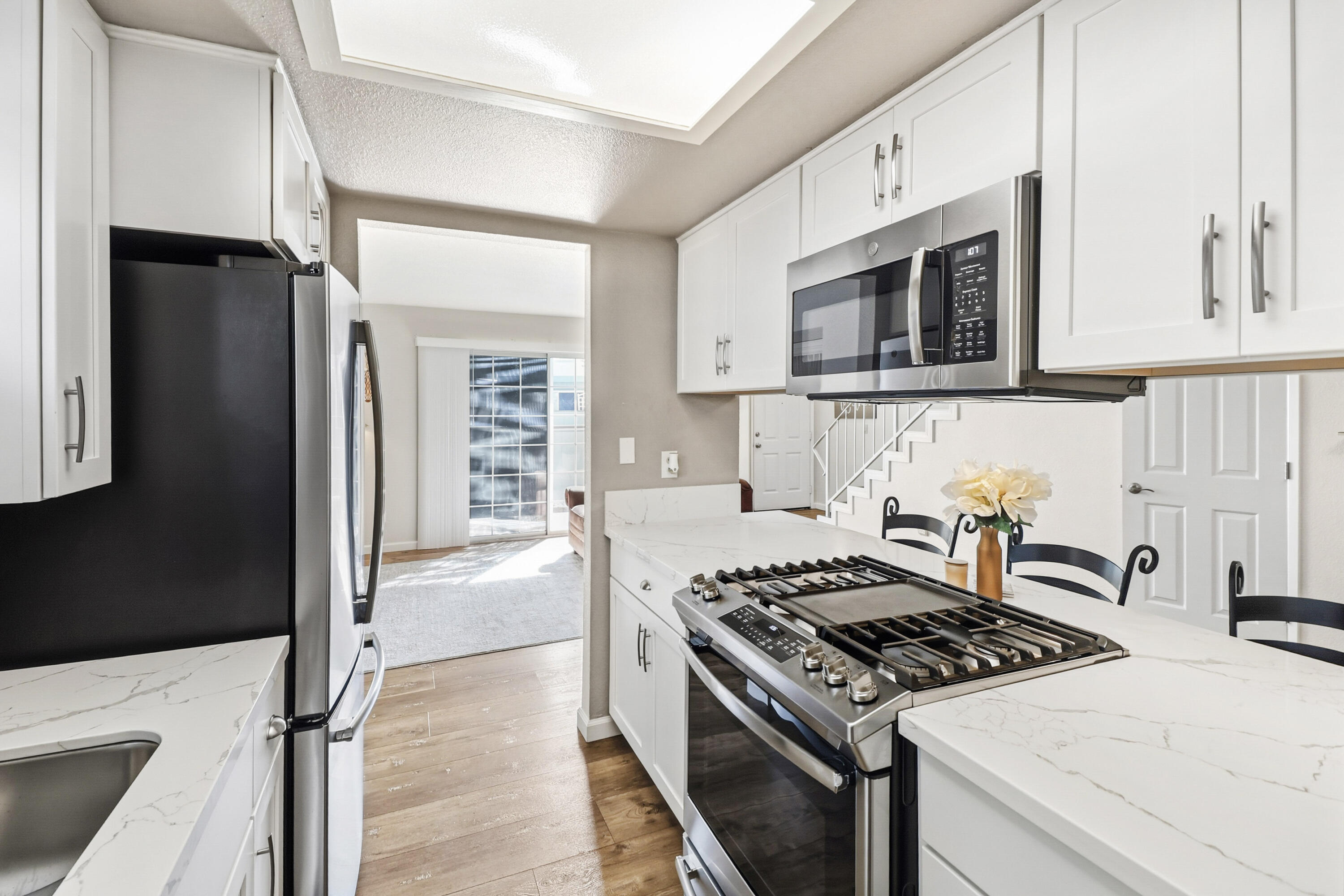 200 Ridgetop Drive, Unit 31 Redding, CA 96003 - Photo 11 of 34 a kitchen with stainless steel appliances granite countertop a stove and a refrigerator