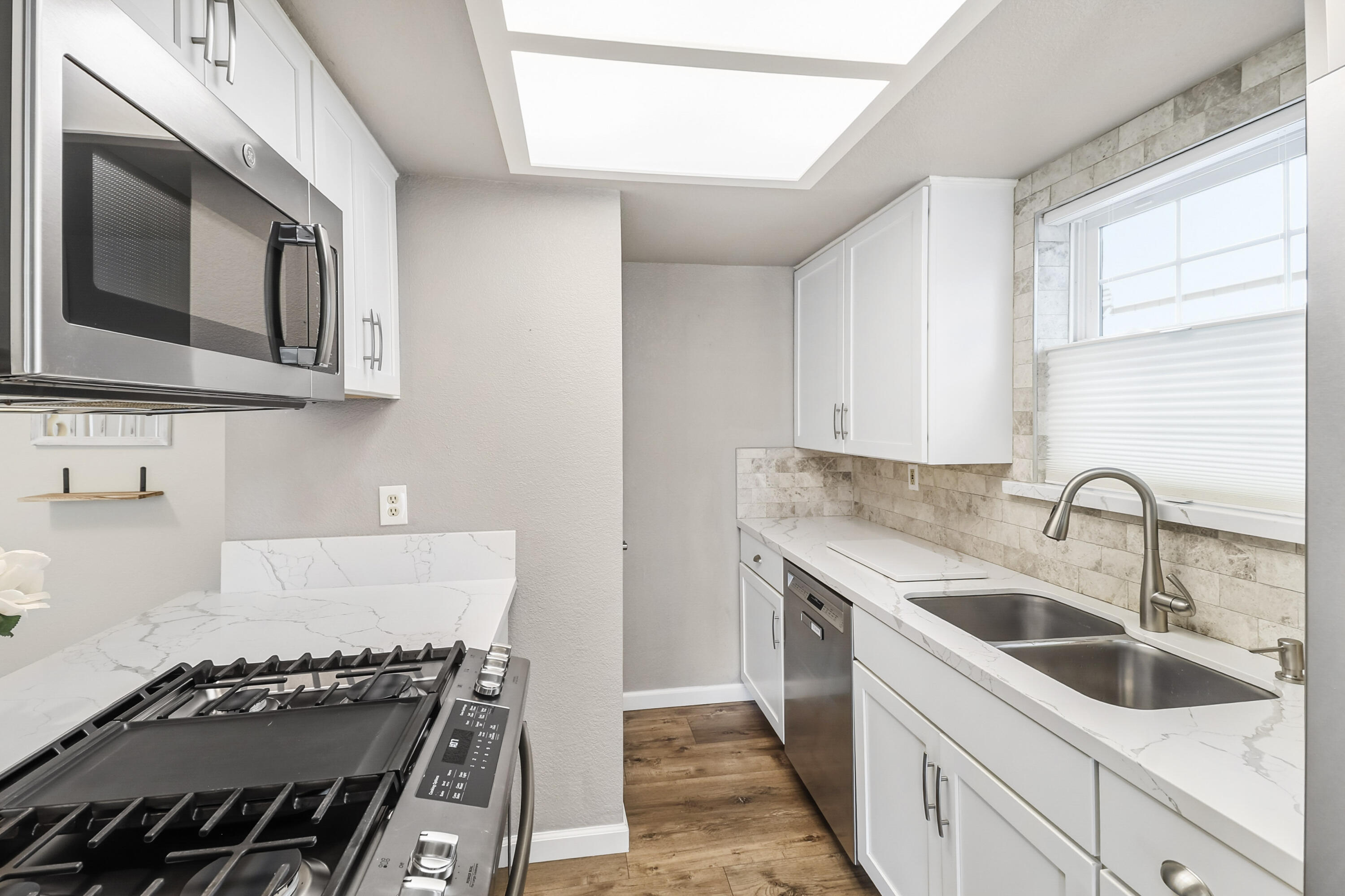 200 Ridgetop Drive, Unit 31 Redding, CA 96003 - Photo 12 of 34 a kitchen with stainless steel appliances granite countertop a sink and a stove