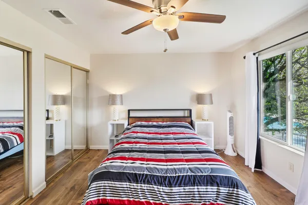 a bedroom with a bed and window