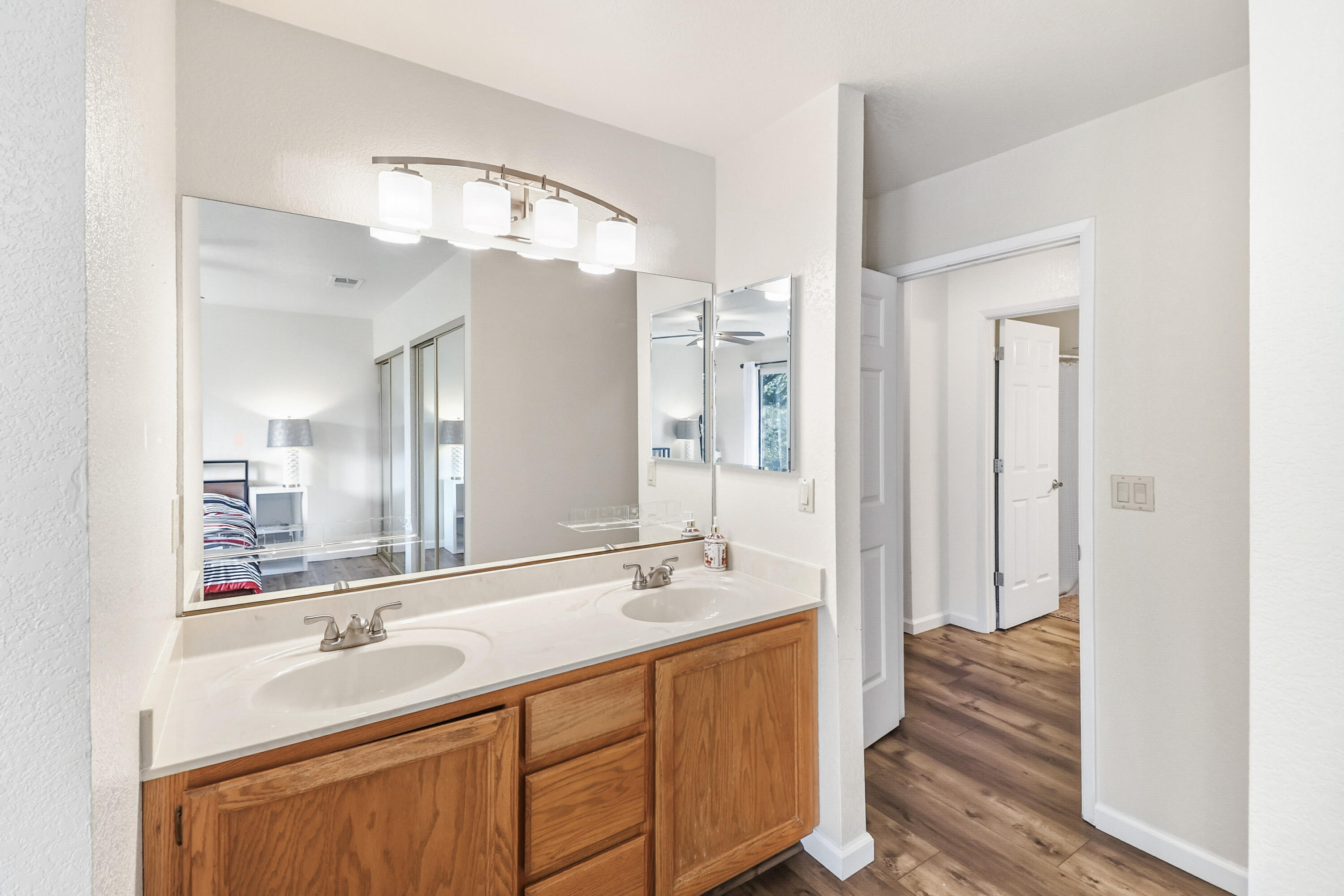 200 Ridgetop Drive, Unit 31 Redding, CA 96003 - Photo 20 of 34 a bathroom with a double vanity sink and mirror with shower