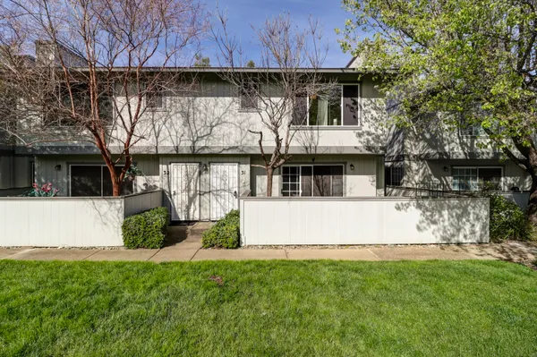 a view of house with backyard