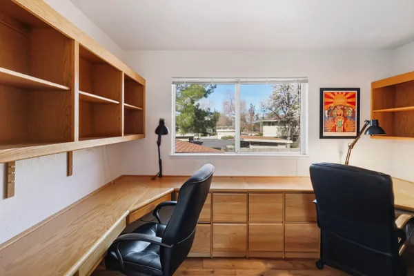 a view of a yard with a house and large trees