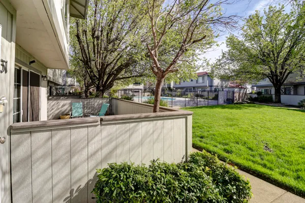 a kitchen with refrigerator and cabinets