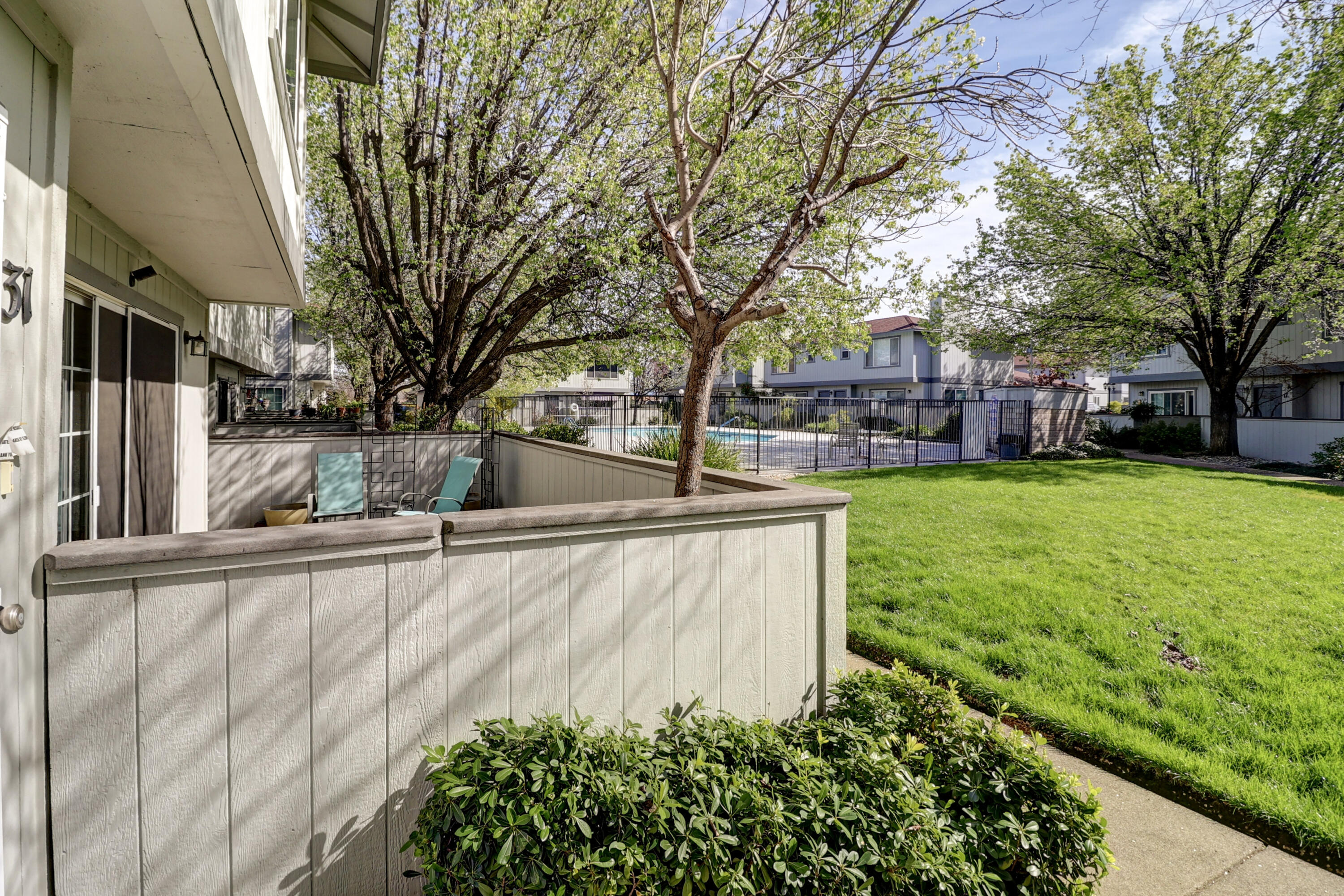 200 Ridgetop Drive, Unit 31 Redding, CA 96003 - Photo 26 of 34 a view of a yard with a house and large trees