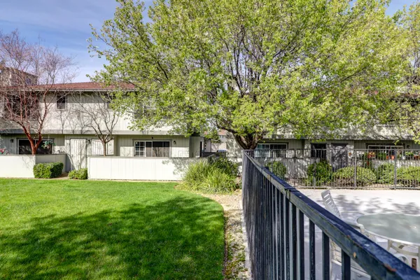 a view of front door and small yard