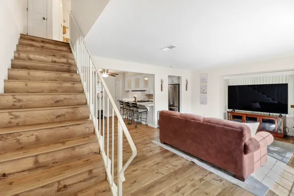 a living room with furniture and a flat screen tv