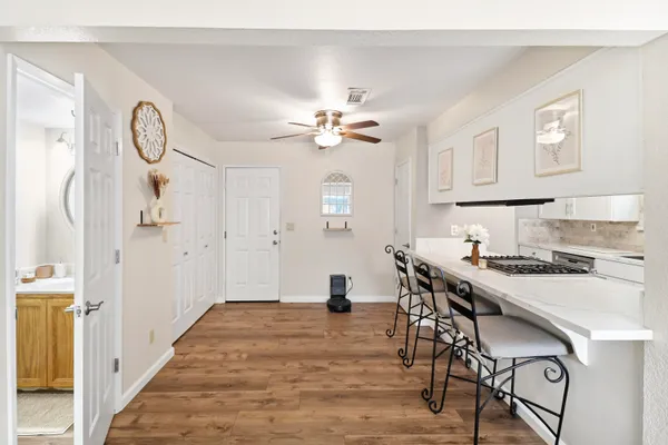 a very nice looking dining room with wooden floor