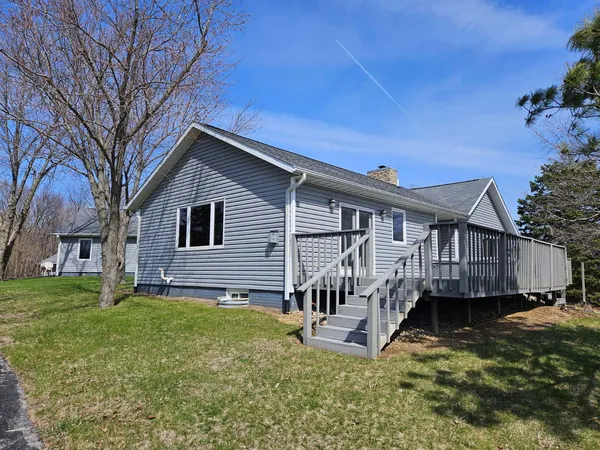 a large kitchen with a large island in the center and a wooden cabinets