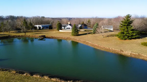 a view of a lake with a yard