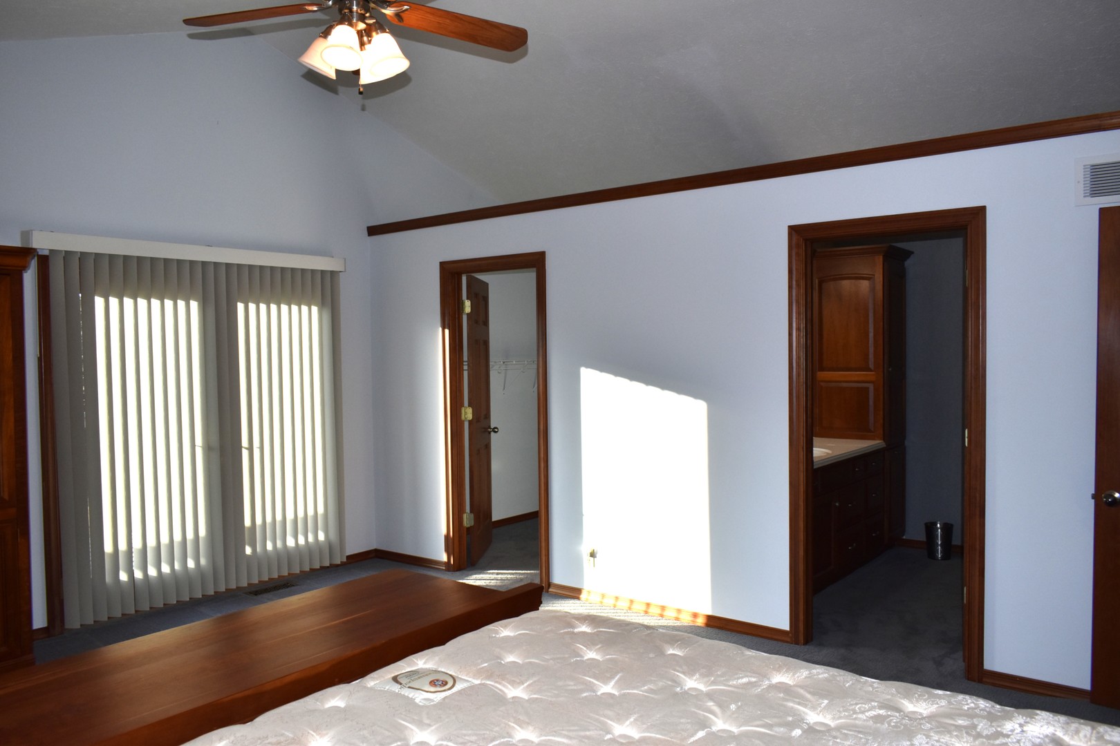 17539 East 2600 North Road Lexington, IL 61753 - Photo 63 of 97 an empty room with wooden floor chandelier fan and windows