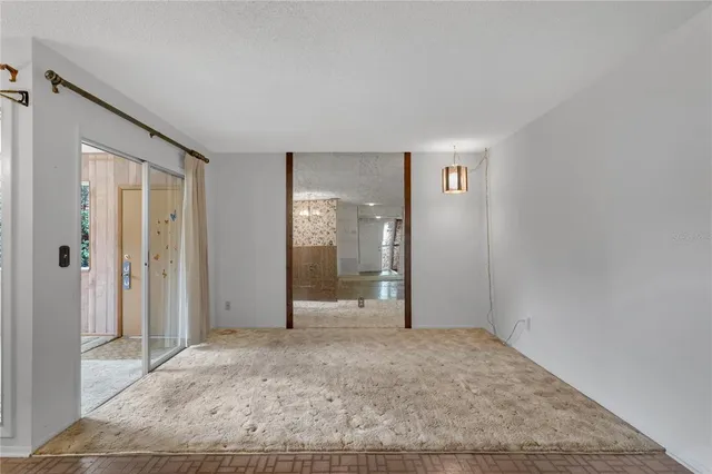 a view of a livingroom with a kitchen space and a sink
