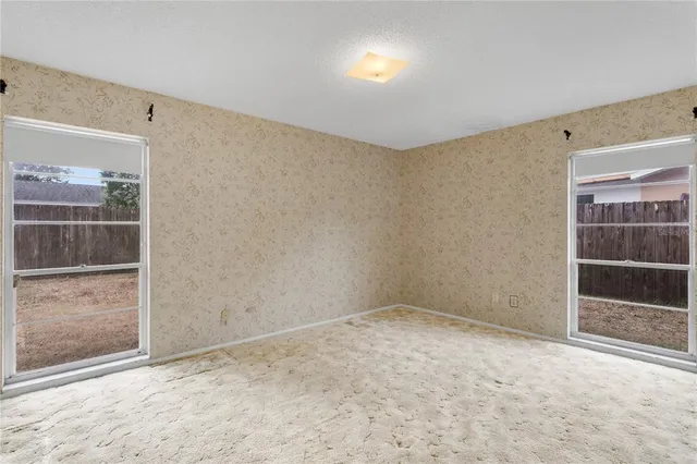 a backyard of a house with a tree