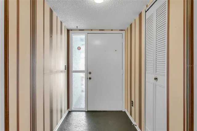 a view of entryway with wooden floor