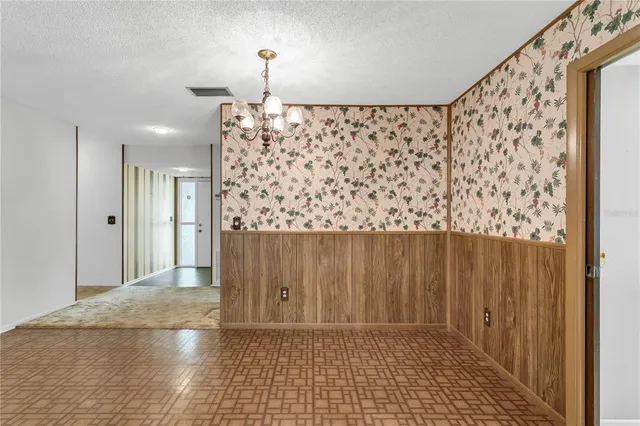 a kitchen with a stove cabinets and refrigerator
