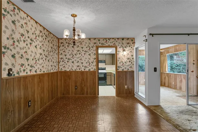 a kitchen with a refrigerator and a stove