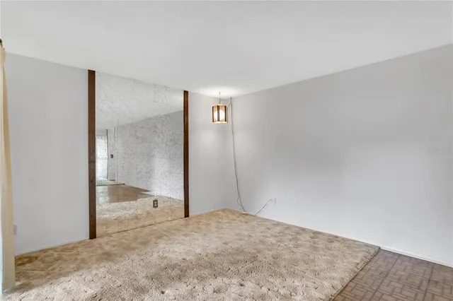 a white refrigerator freezer and a table in a kitchen